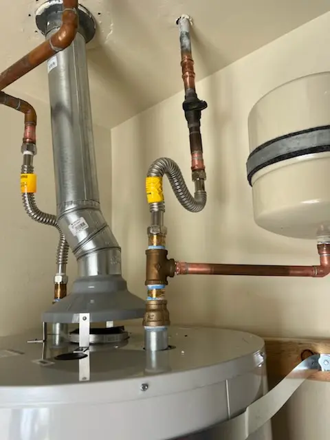 Water heater installation and plumbing repair in De Graff
